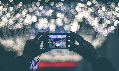 taking mobile photos Person using a mobile phone to take a photo
