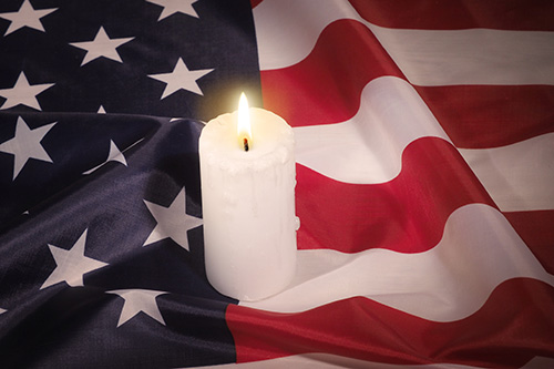 American flag and candle American flag with a white candle