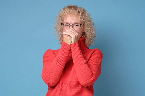 Pretty older adult woman laughing