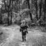 Soldier walking alone in the woods