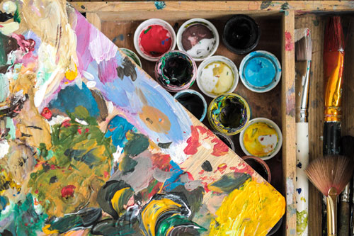 Cups of paint, a pallet and brushes
