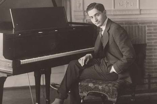 IrvingBerlin Picture of Irving Berlin sitting at a piano