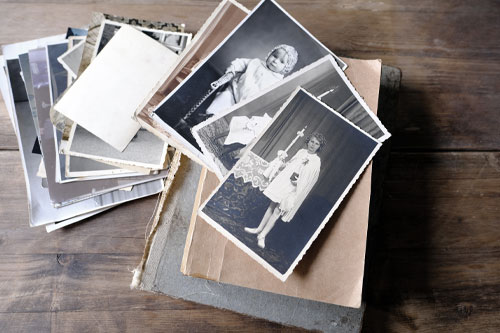 Group of black and white family photos on a table