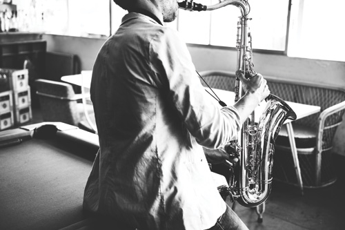 blues Ma playing a tenor saxophone
