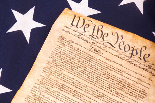 United States Constitution in front of the AFerican Flag