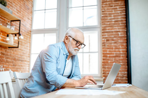 Older adult male using a computer
