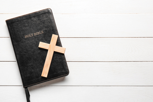Wooden Cross on top of the bible