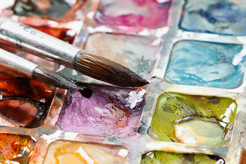 Set of watercolor paints and paintbrushes for painting