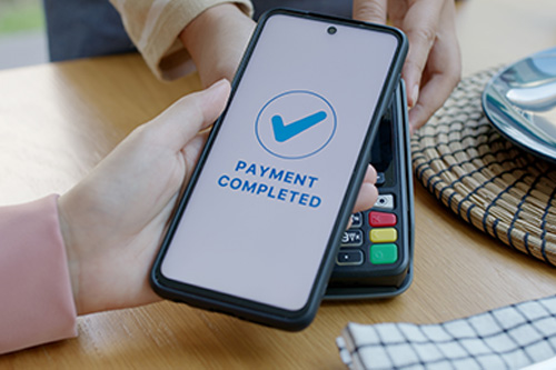 Woman completing a digital payment