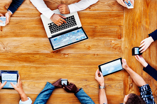 People using laptops, smartphones and tablets to access the inetnet