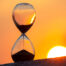 Hourglass in front of the sun