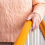 MAn holding a handrail as he goes down stairs